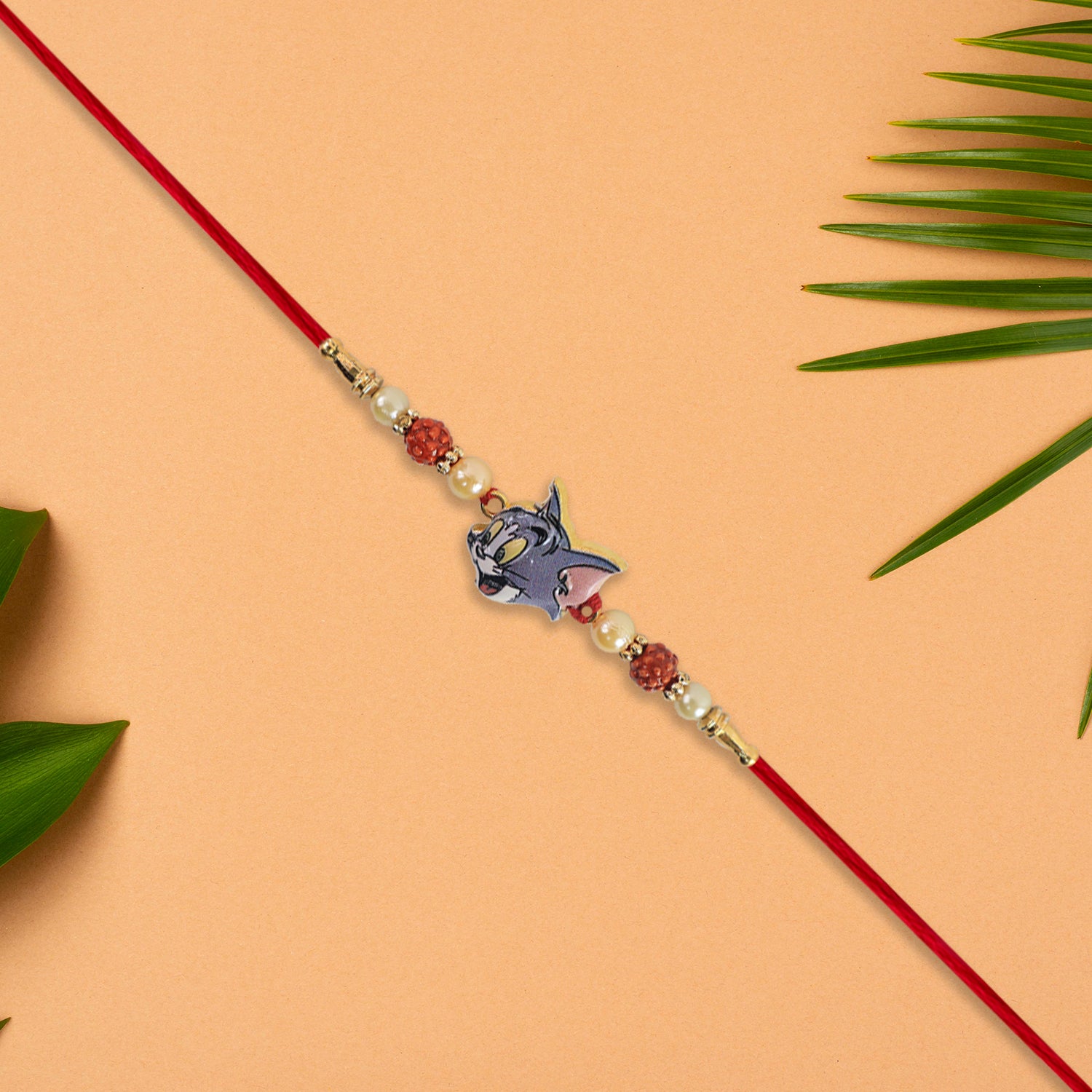 Cute Tom Character Rakhi With Rudraksha  Pearl Beads On Red Thread